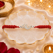 Silver "Bhai" Name Rakhi – Elegant Script Charm on Handwoven Red Thread