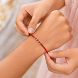 Minimalist Silver Bead Rakhi – Handcrafted Red Thread Designer Rakhi