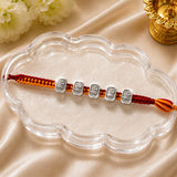 Silver Shri Rakhi – Auspicious Shri Charm on Traditional Red Thread
