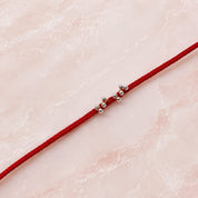 Minimalist Silver Bead Rakhi – Handcrafted Red Thread Designer Rakhi